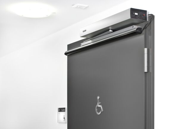 Swing door drive - Slimdrive EMD-F, VGH Versicherungen (insurance company) Hanover Electromechanical swing door system for double leaf fire and smoke protection doors with integrated mechanical closing sequence control and integrated smoke switch