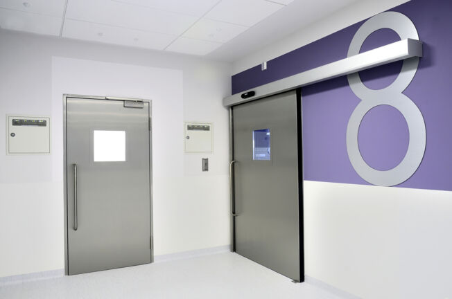 Hygienic Doors at Children's Memorial Health Institute Operating room doors in the corridor of the Children's memorial Health Institute in Warsaw, Poland. Hygienic doors, doorway, window and safety technology for health care, for hospitals.
