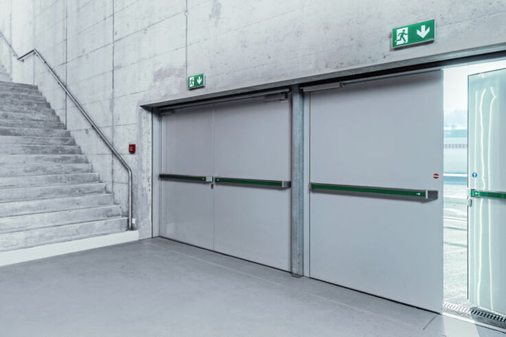 Hold-open systems - With hold-open systems, fire protection doors in your building can be used for barrier-free accessibility. Like a door hold-open device, they keep doors open. In an emergency, they close fire protection doors automatically and safely.